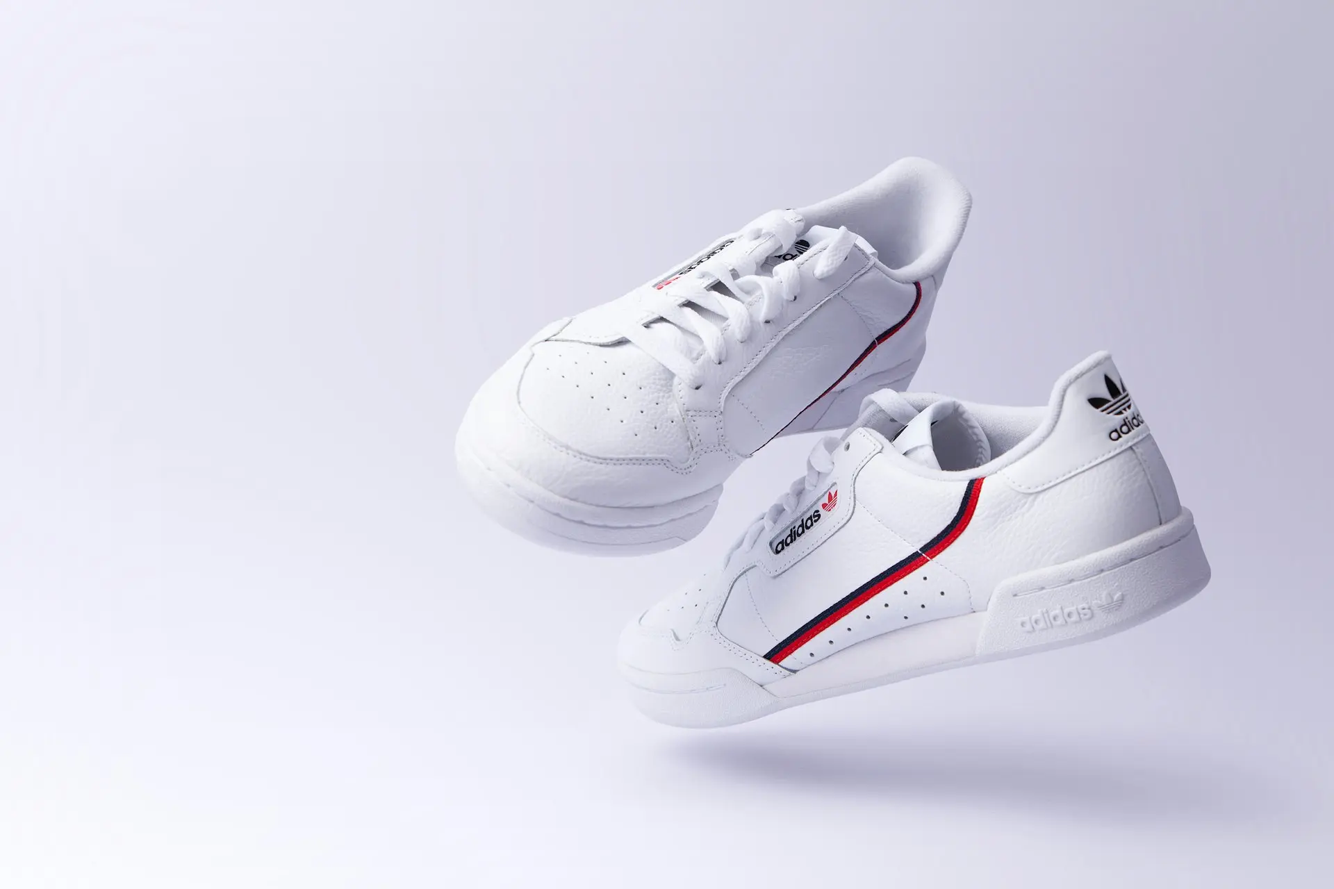 white adidas low-top sneakers
